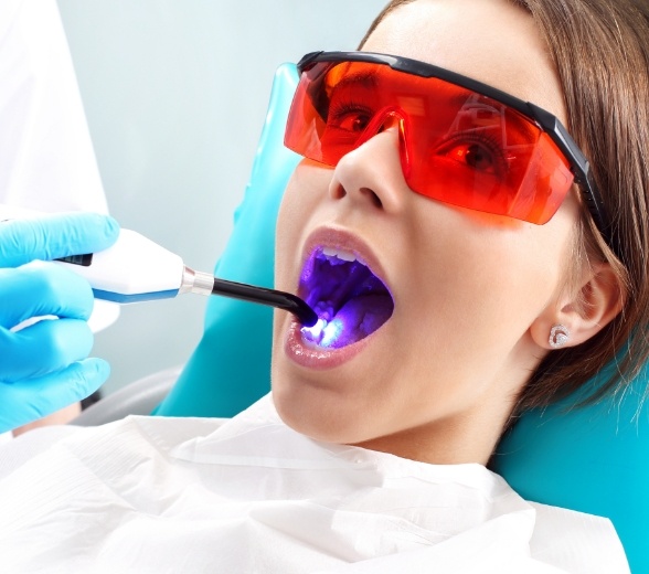 Patient receiving dental sealants