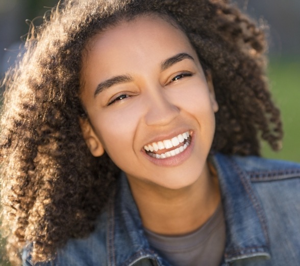 Patient smiling after fluoride treatment