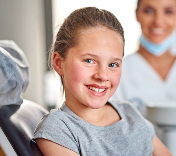 Young child smiling after pulp therapy