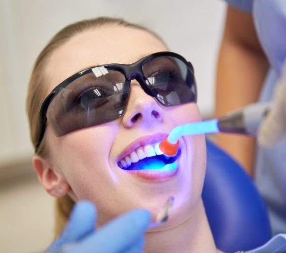 Dental patient receiving cosmetic dental bonding