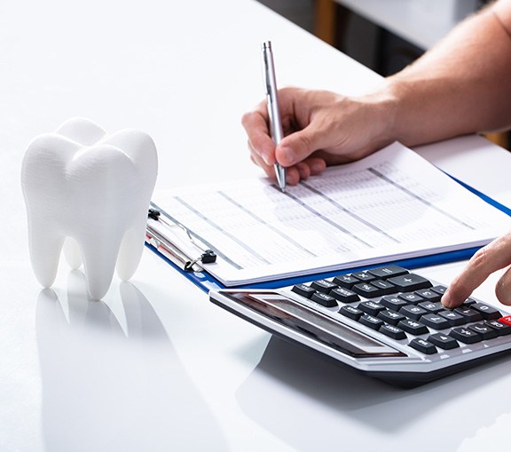 Greenville patient reviewing dental crown cost