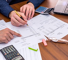 Greenville patient checking dental insurance coverage for Dental Crowns