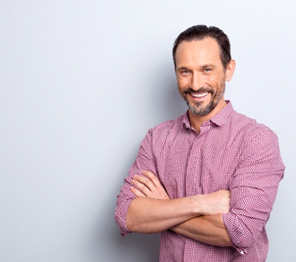 Smiling man in red plaid shirt