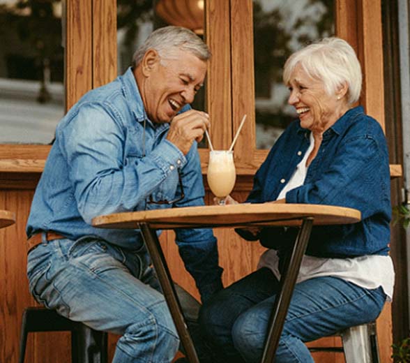 Couple smiling with dentures in Greenville