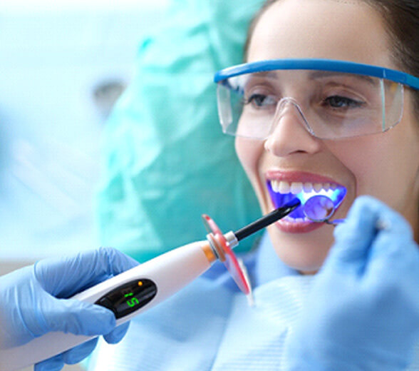 Woman getting a tooth-colored filling in greenville