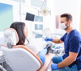 Woman talking to her dentist in Greenville