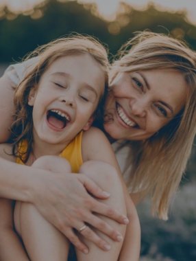 Mother hugging her young daughter