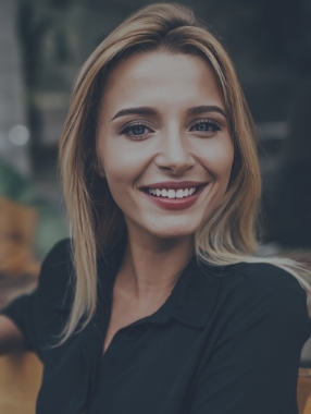 Smiling blonde woman with straight white teeth