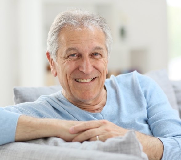 Man with dentures smiling