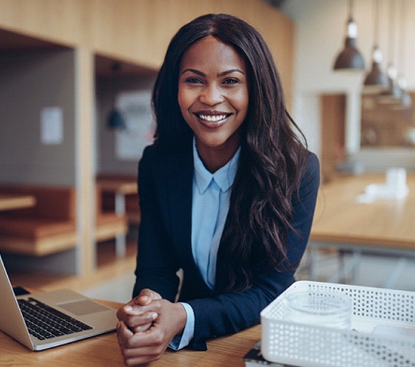 Businesswoman smiling with veneers in Greenville