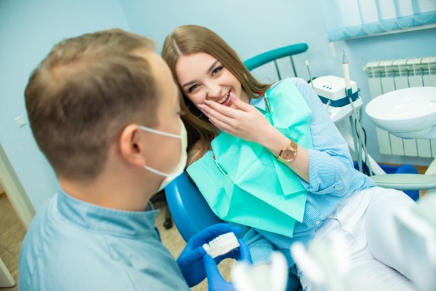 Woman at the dentist for root canal therapy.