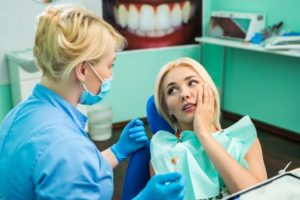 patient with a dental emergency and questions about dental insurance