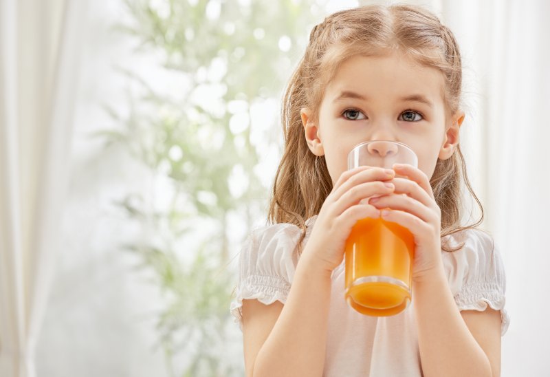 a child drinking fruit juice in Greenville