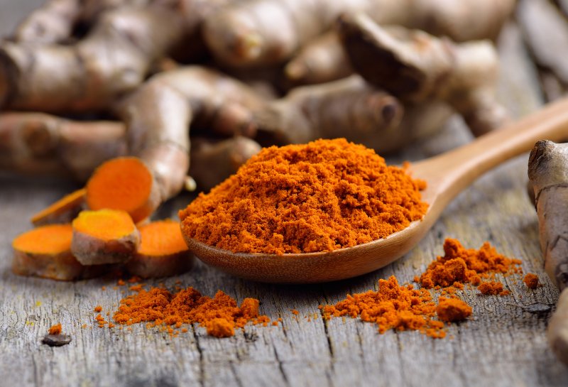 Turmeric powder on a wooden table